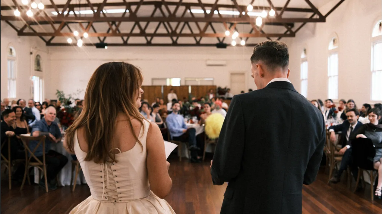Spacious timber wedding reception hall with seated guests enjoying premium event catering by Peter Rowland.